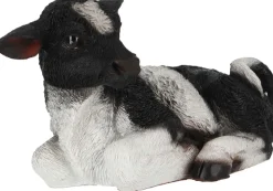 Veau noir et blanc couché en résine (Petit modèle)