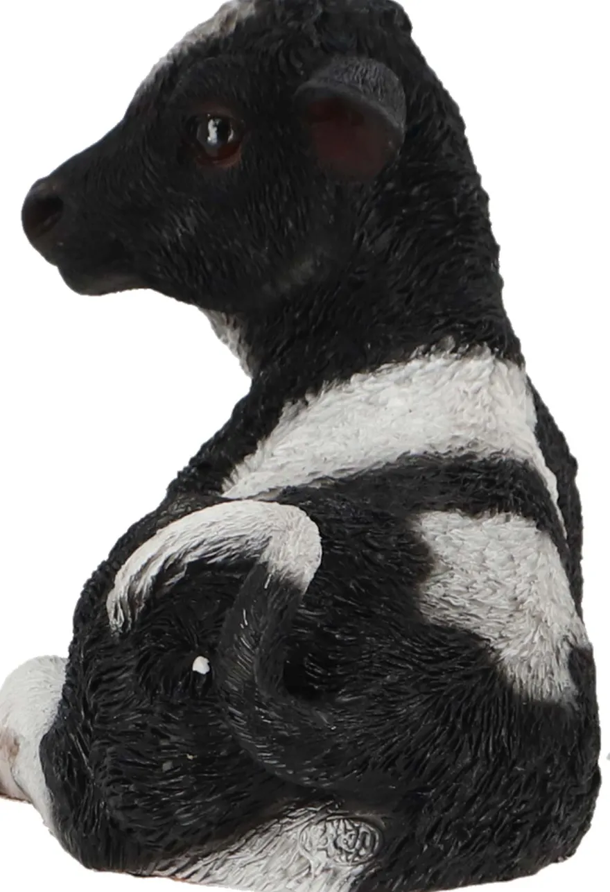 Veau noir et blanc couché en résine (Petit modèle)